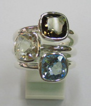 sterling silver Smoky quartz, white topaz and blue topaz rings worn together.