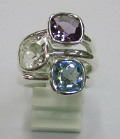 sterling silver Amethyst, white topaz and blue topaz rings worn together.